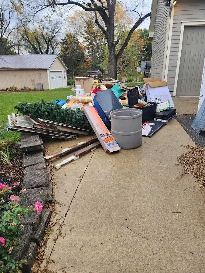 Dumpster being loaded with debris for Roofing Dumpster Rental in Solebury